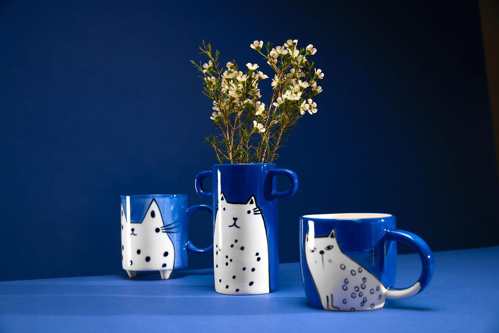 Hand painted blue mug with cat illustration