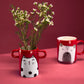 Small handmade red vase with cat illustration