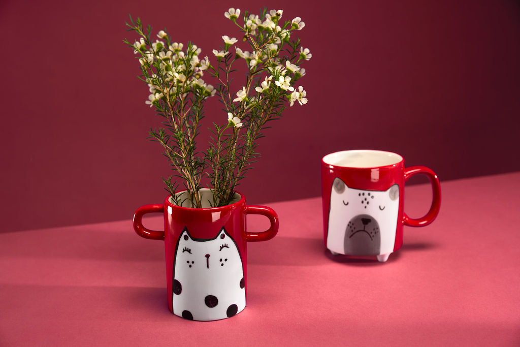 Small handmade red vase with cat illustration