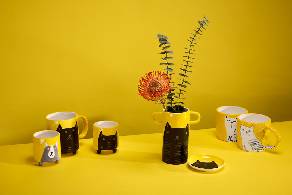 Handmade yellow vase with a black cat illustration