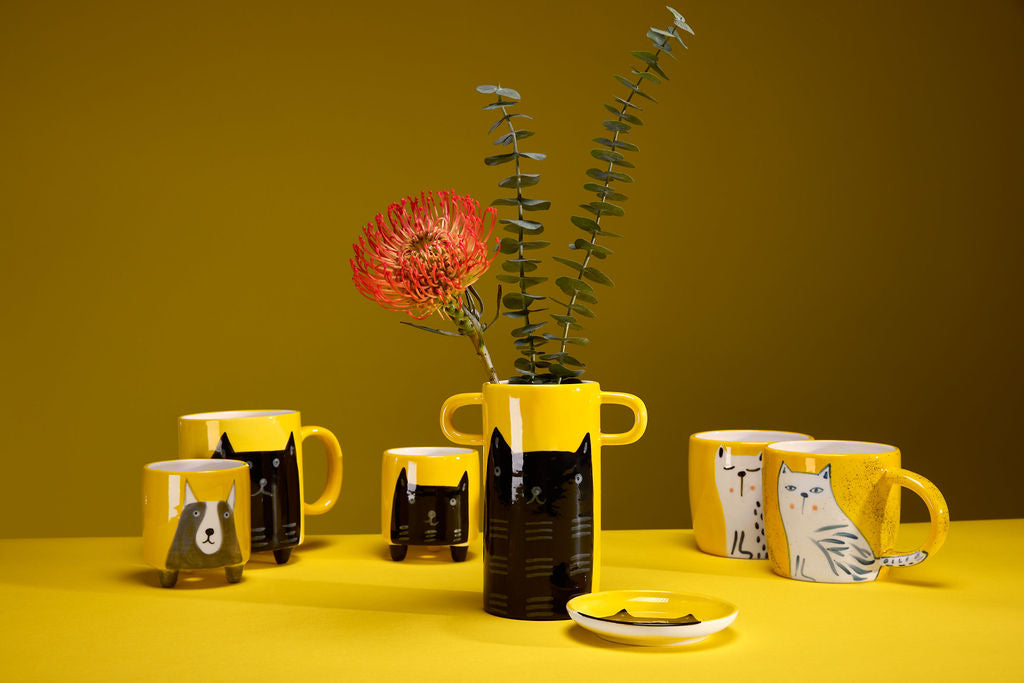 Handmade yellow vase with a black cat illustration