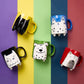Hand painted black mug with cat illustration
