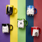 Hand painted black mug with cat illustration